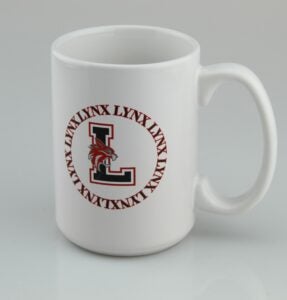white mug with Lincoln L and the word Lynx 8 times forming a circle around it